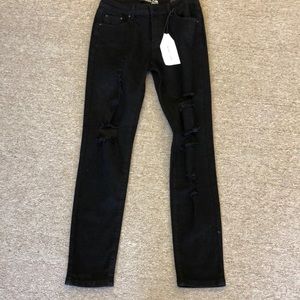 Black ripped jeans. Monkey Ride.